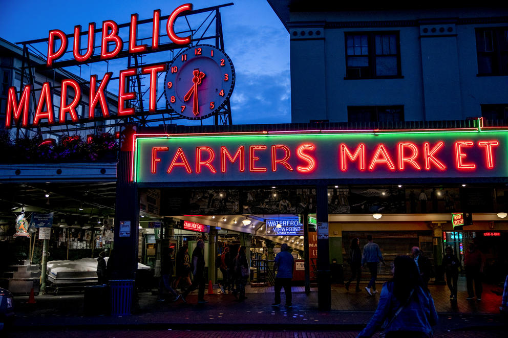 Pike Place Market sign aglow at night