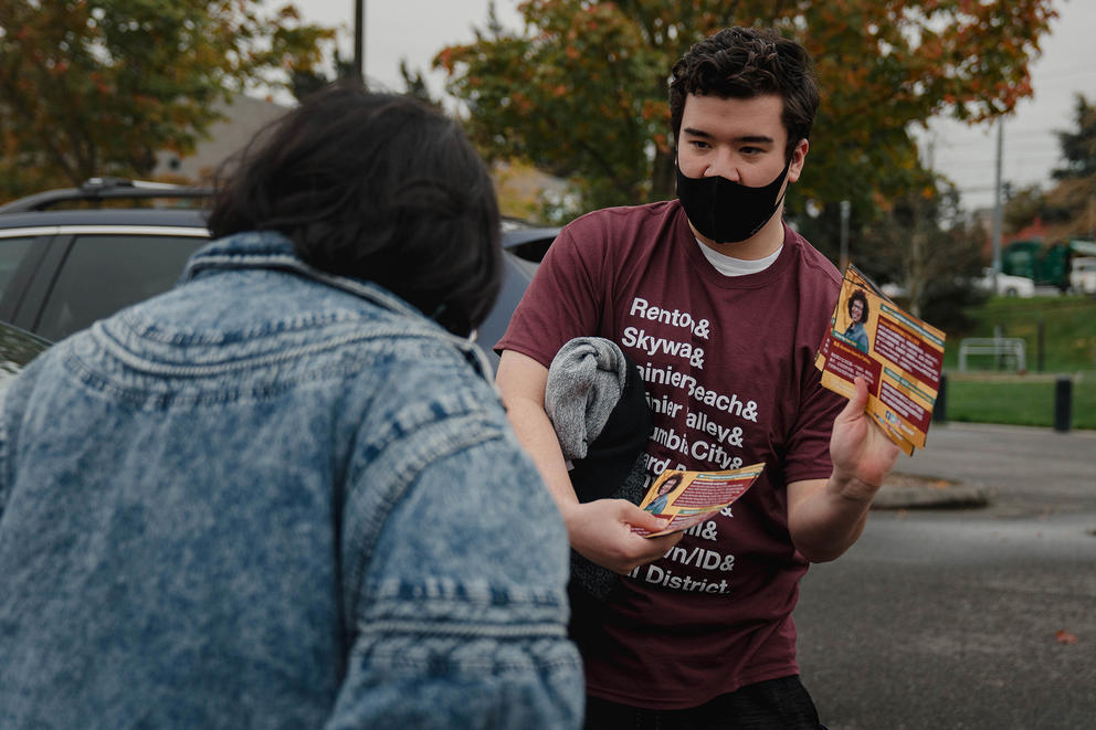 man passing out campaign literature
