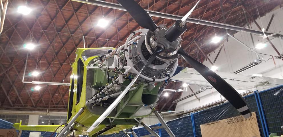 A modified DHC-2 Beaver floatplane sits in a hangar.