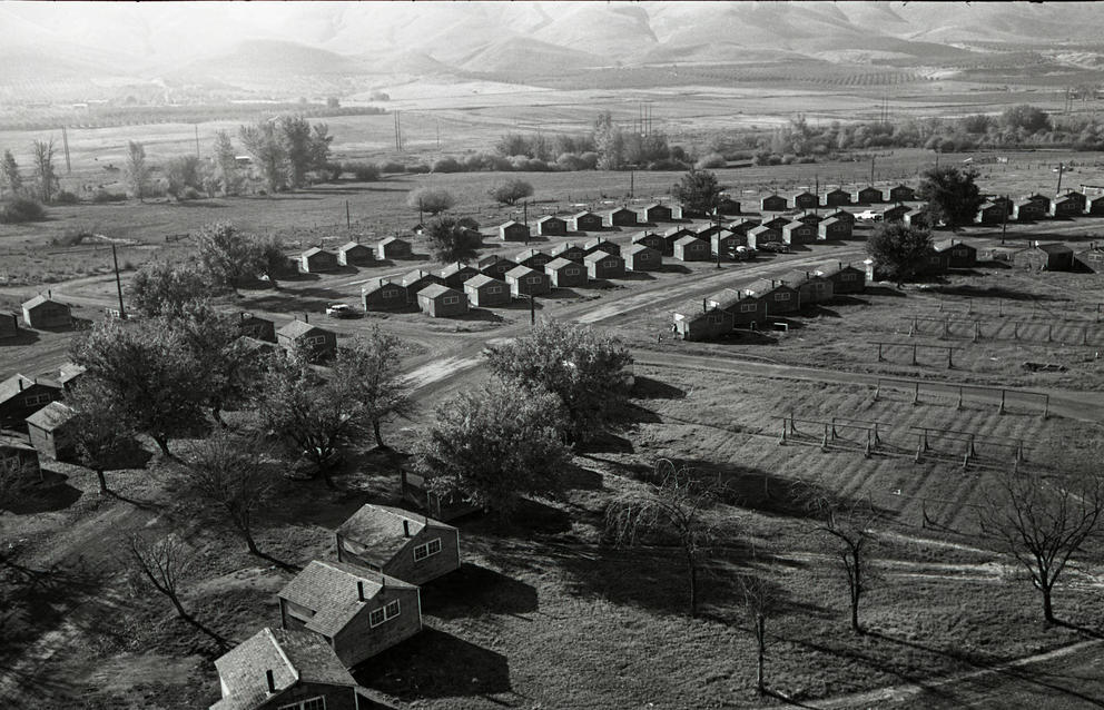 a vintage black and white photo of farmworker housing
