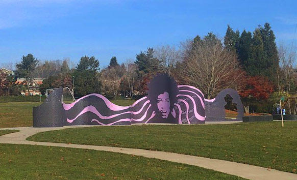 photo of purple Jimi hendrix sculpture in a park
