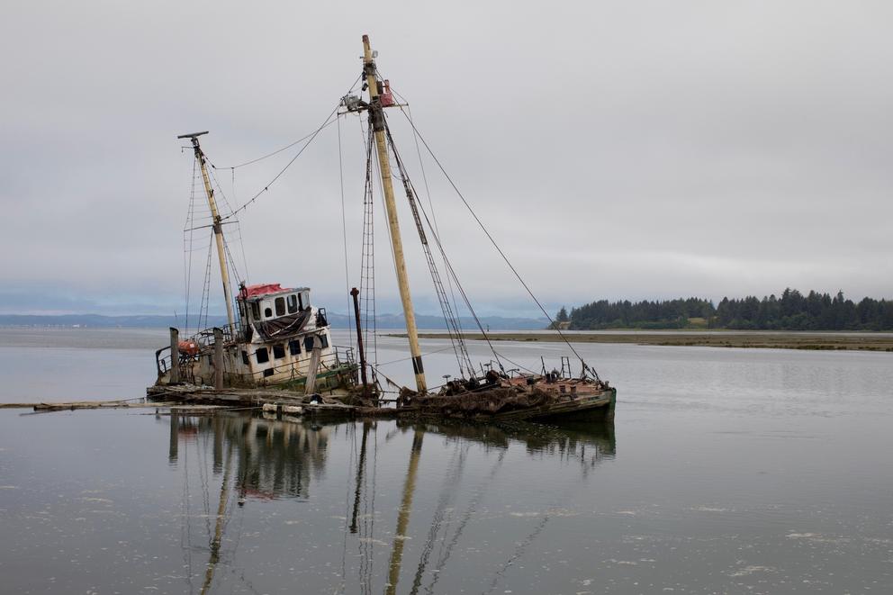 R/V Hero, a 125-foot wooden-hulled Antarctic research vessel, sank in March 2017 on the Palix River near Bay Center, Washington. Built in 1968, she was fitted with sails and labs for wildlife research but now poses a threat to oysters, other wildlife and navigation.