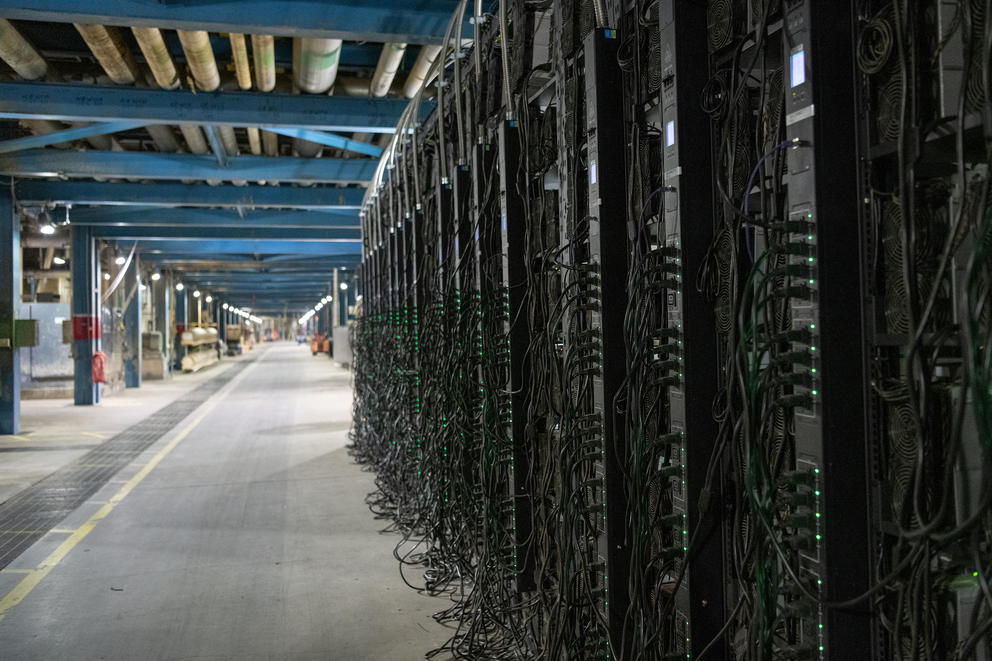 A long row of server machines inside a facility