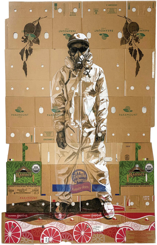 Portrait of a farmworker on boxes