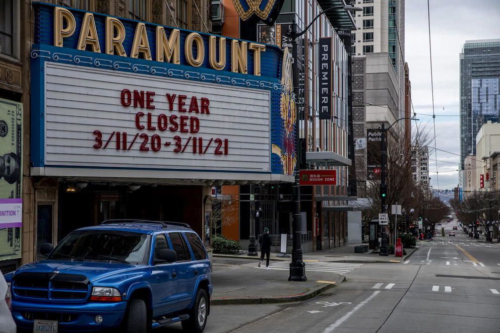 The marquee of the Paramount Theater seen from the street reads "one year closed"