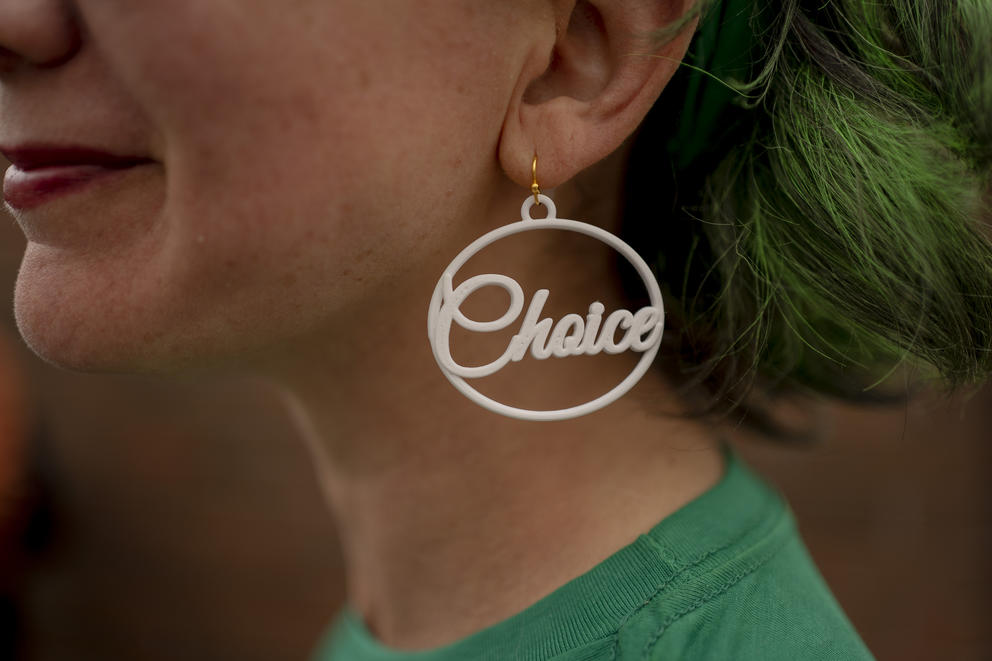 Close up: Emily Pinzur wears an earring that says “Choice,” which pairs with one on her other ear that says “Pro,