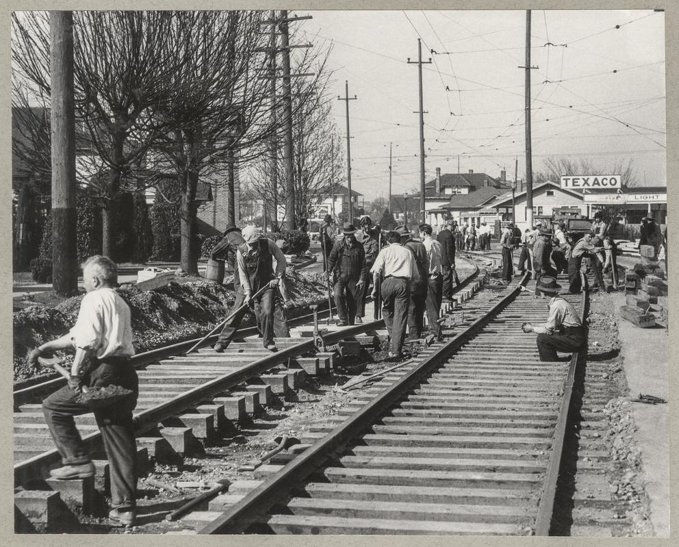 workers building tracks