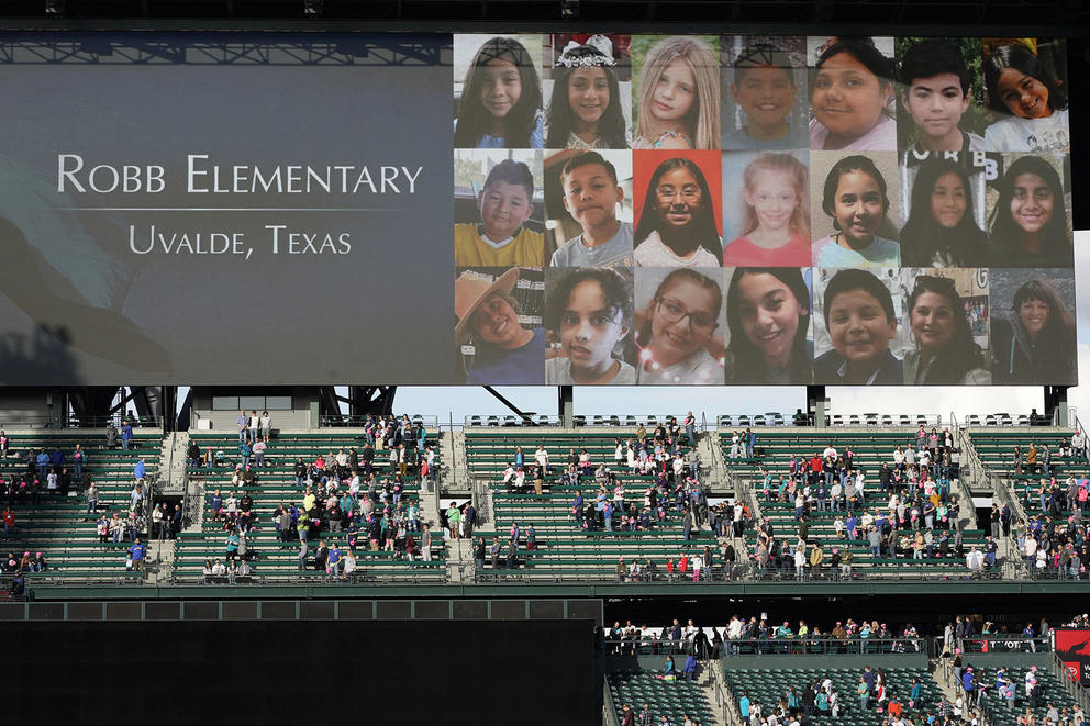 A video display at T-Mobile Park in Seattle shows a collage of the victims of the shooting at Robb Elementary School in Uvalde, Texas.
