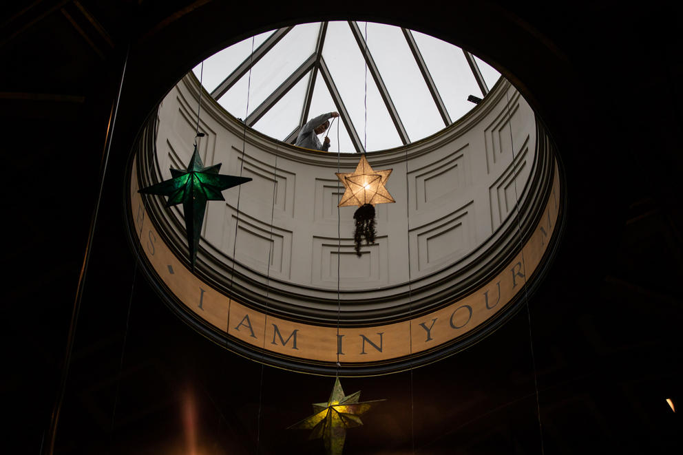 lanterns are lowered from a circular skylight