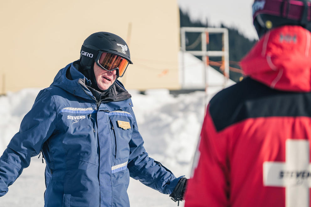 Ski manager talking to employee