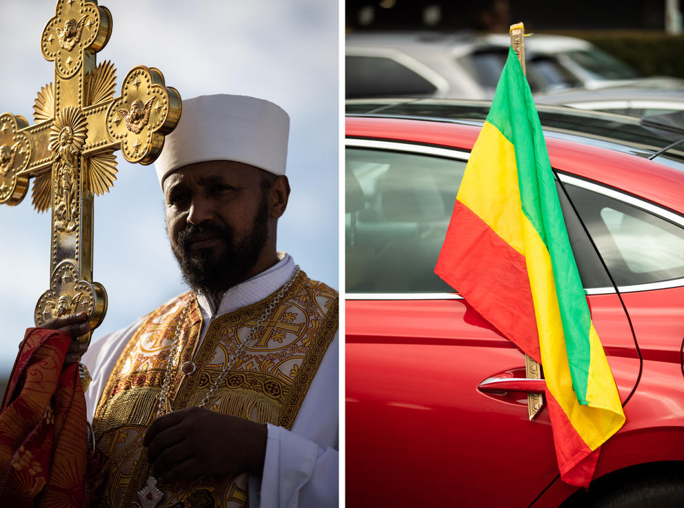 At left, a priest holds up a large golden cross. At right, an Ethiopian flag is tucked in the door handle of a red sedan,