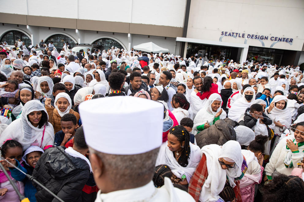 A crowd of people in white religious garb