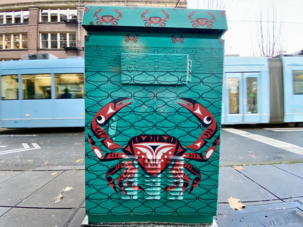 red formline crab on green background on electrical box