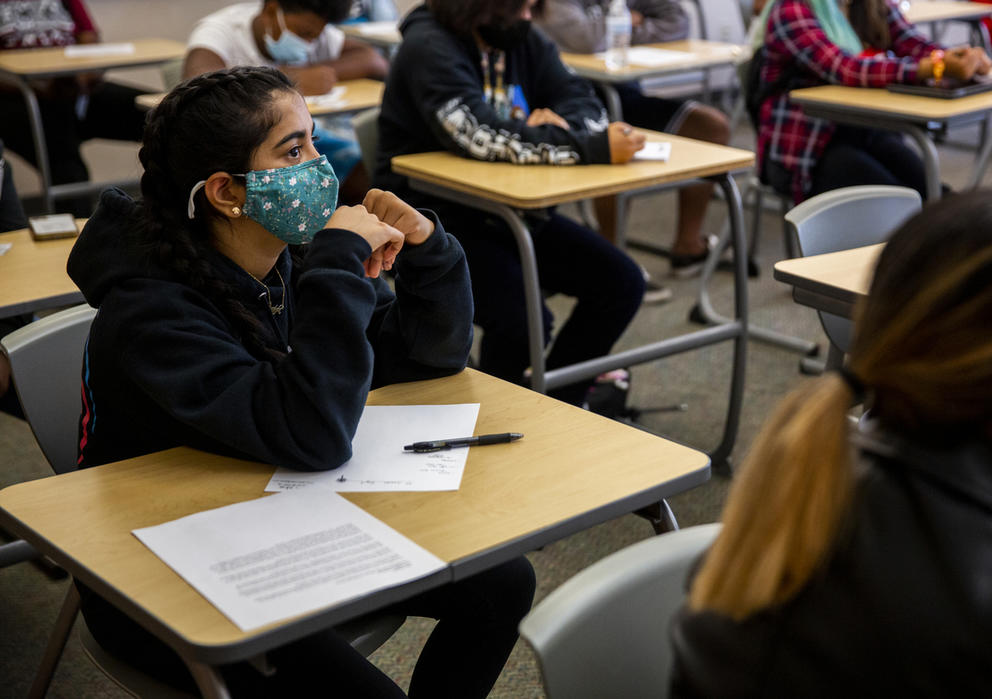 Anastasha Kathireson listens to Dean of Students Rosalia Burson lead their team in an exercise on day one of a two-day Jumpstart orientation program for incoming 9th graders at Mount Tahoma High School in Tacoma, Wash., in this Aug. 25, 2021 file photo. (Lindsey Wasson for Crosscut)