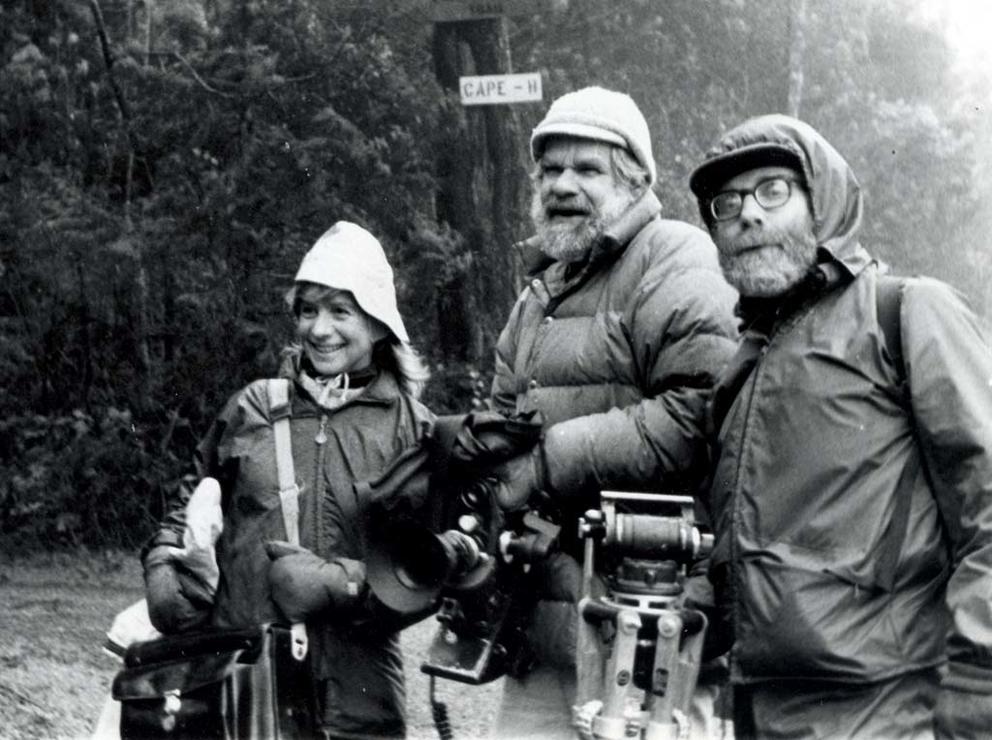vintage photo of three people in rain gear and TV camera equipment