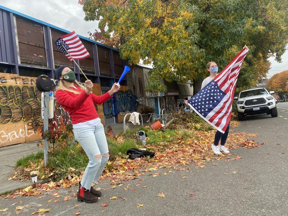 woman wave US flags