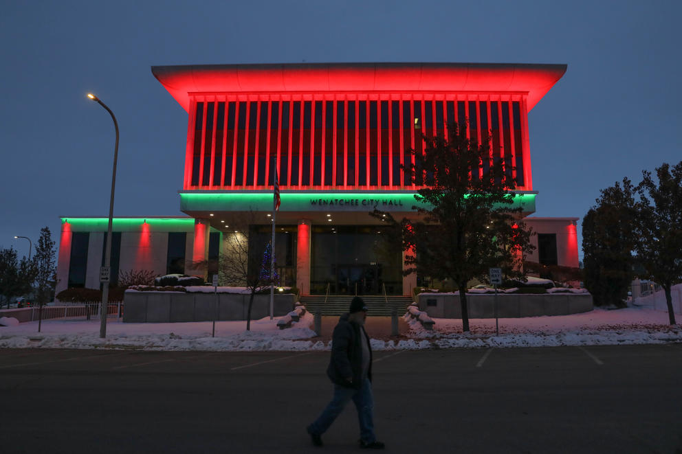 Wenatchee City Hall is lit red and green for the holidays