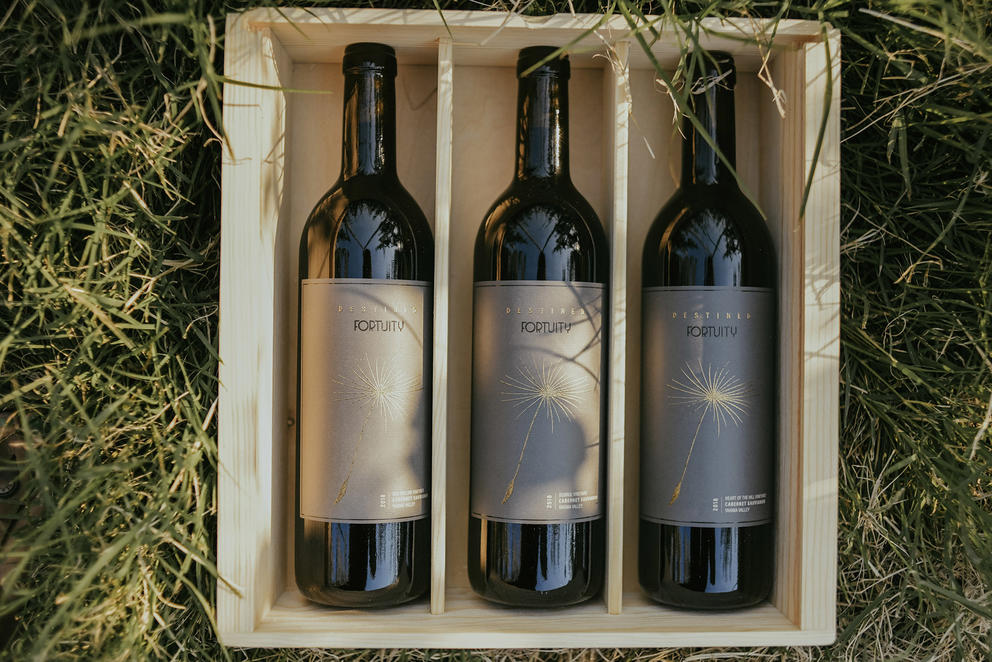 Bottles of wine form Fortuity Cellars without the tin capsules used in their other bottles