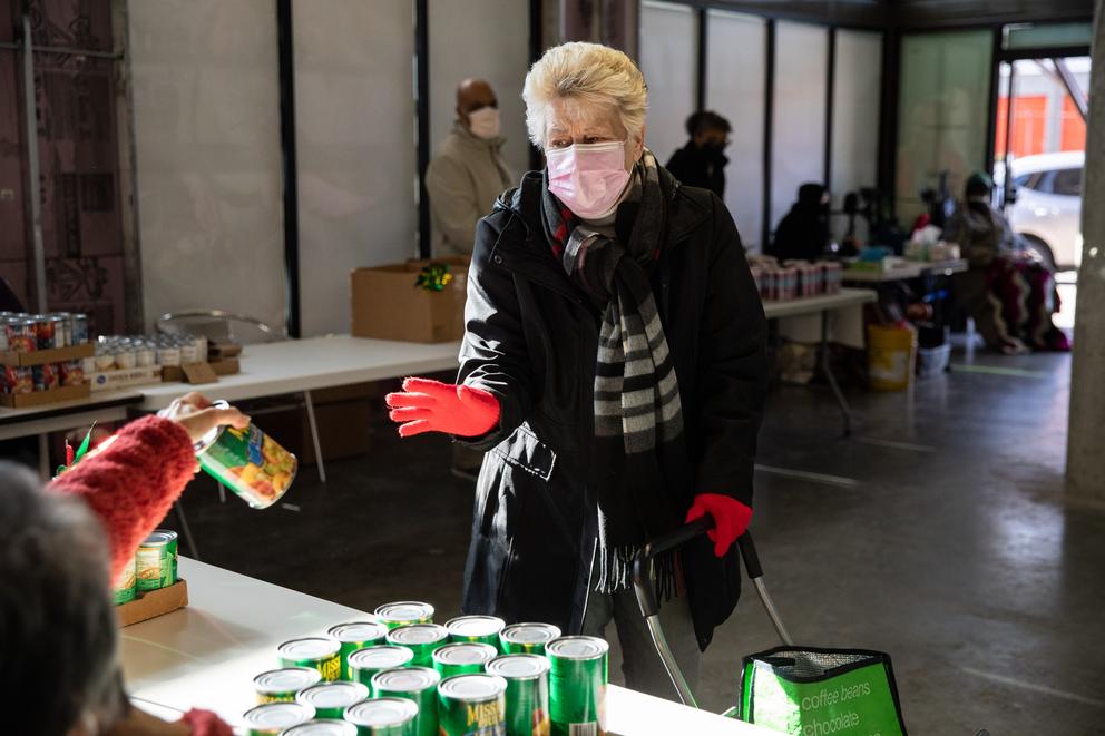 a woman shops at a food bank in Seattle