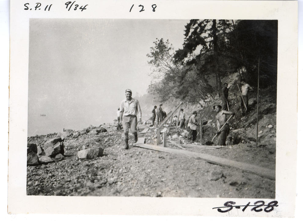Archival image of men at work on a sea wall