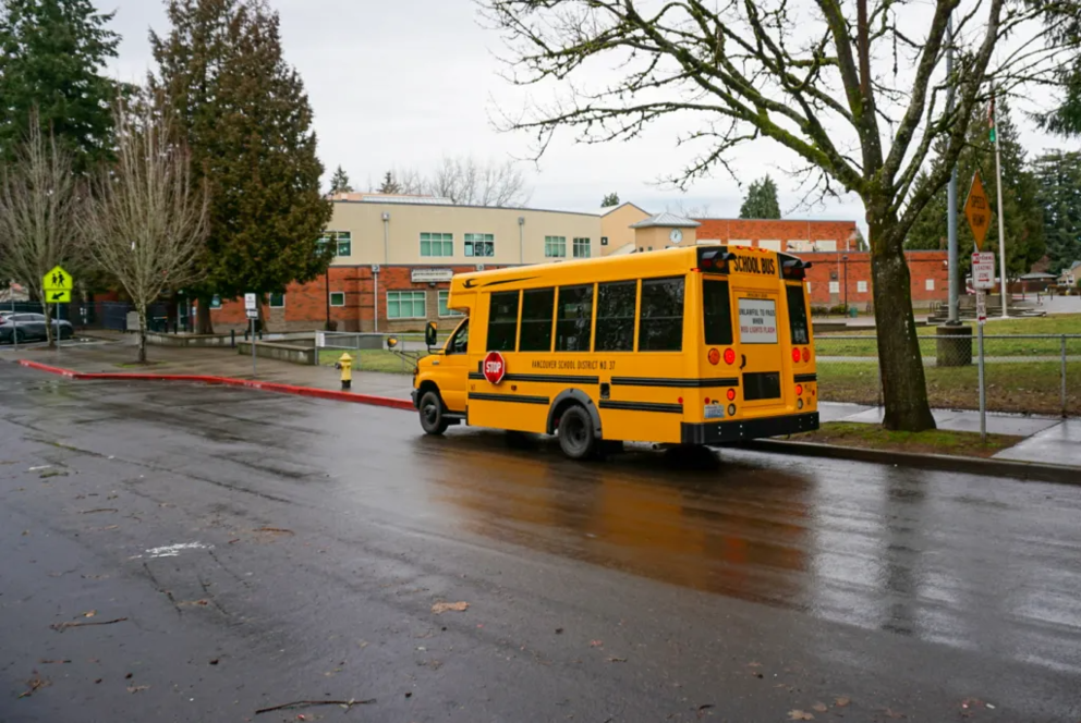School bus parked in front of a building