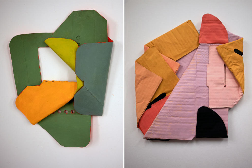 two small sculptures side by side, both made of sculpted cardboard, one in green and yellow the other in pinks and mustards