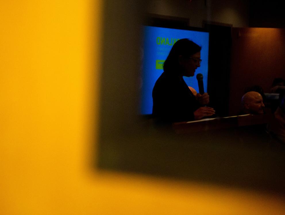 Congresswoman Suzan DelBene is reflected in a window. 