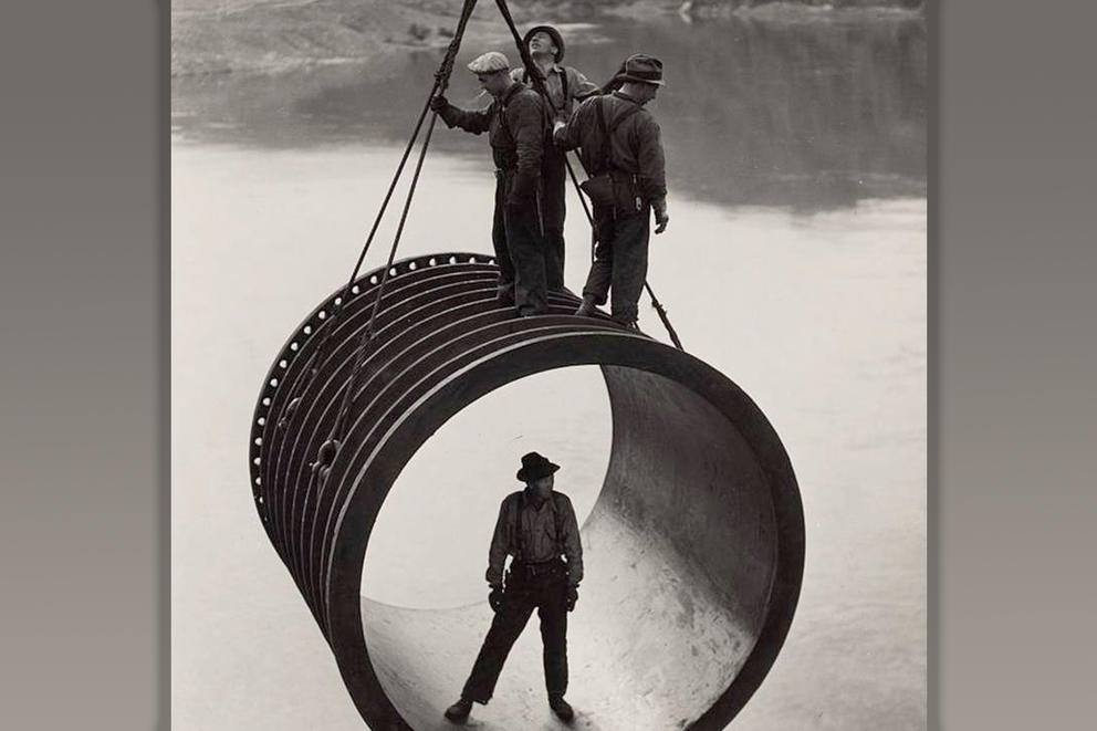 Four men at work on the Grand Coulee Dam.