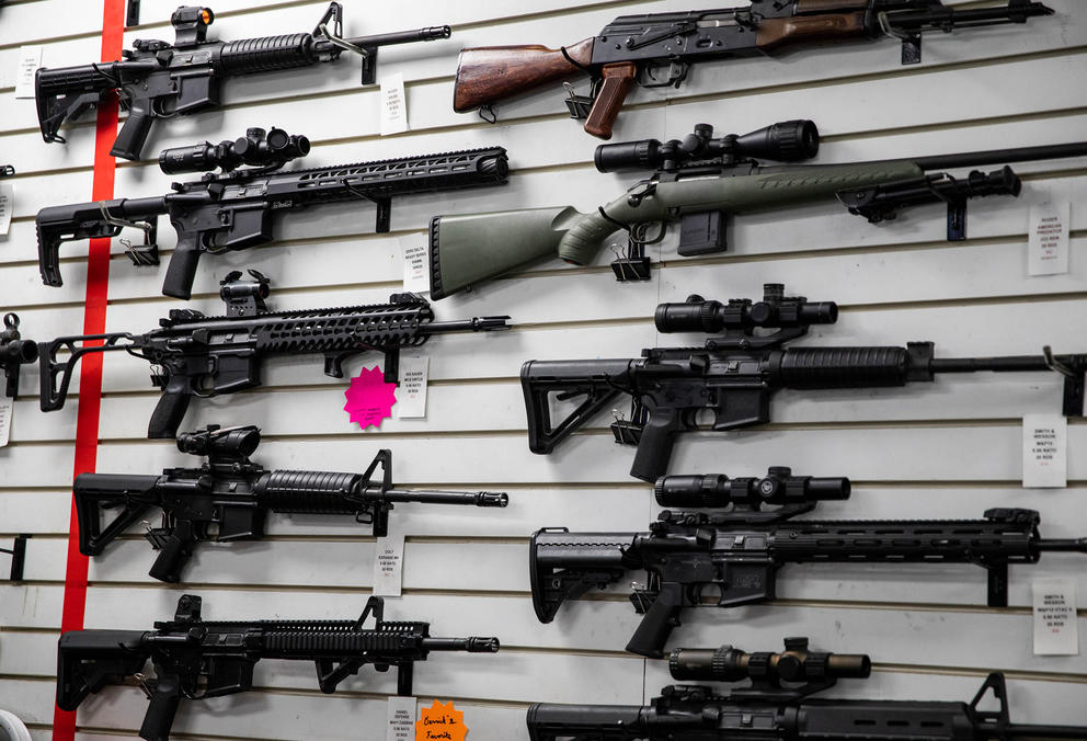 A photo of long guns on the wall of a Bellevue, WA, gun range.