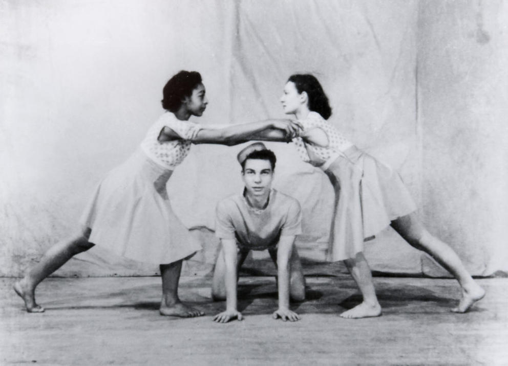 archival photo of three modern dancers from the 1930s making a pyramid shape