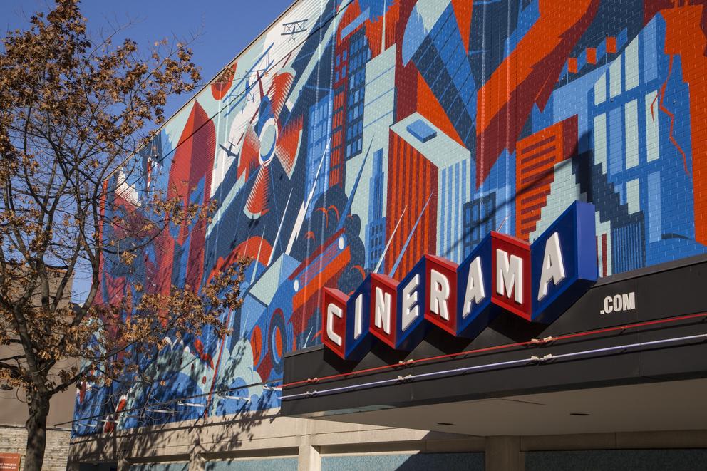 a photo of the blue and red mural adorning the facade of the Cinerama movie theater