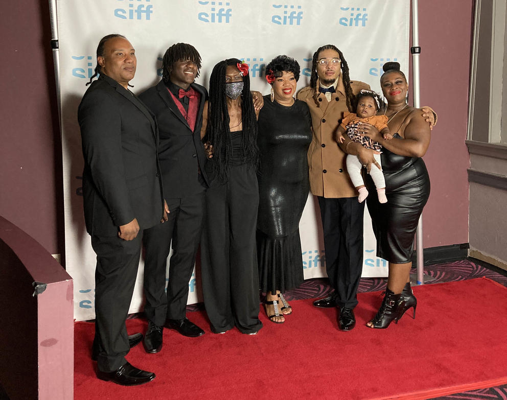 Lady Scribe and her family pose for a photo at SIFF