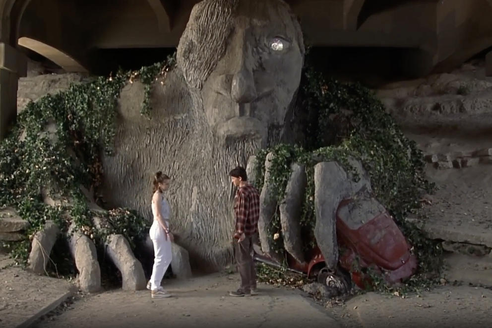 A Scene from 10 things I hate about you in front of the Fremont Troll