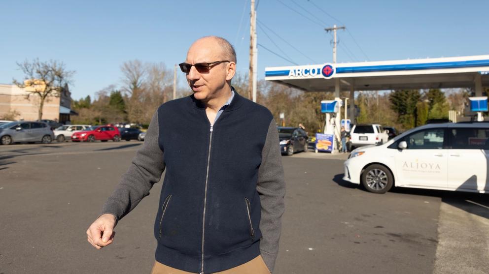 Matthew Metz walks in front of an Arco gas station in Seattle