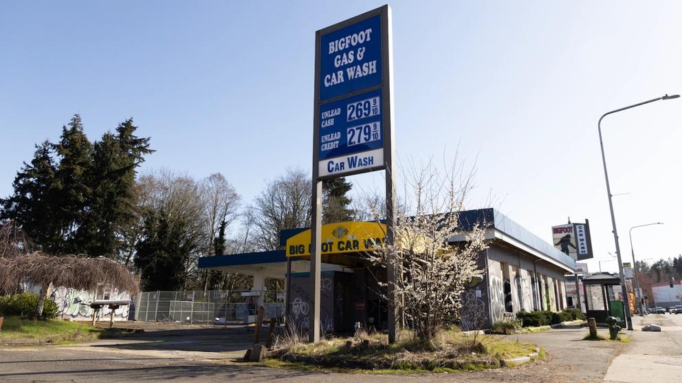A sign stands over the shuttered Bigfoot gas station and car wash in Seattle