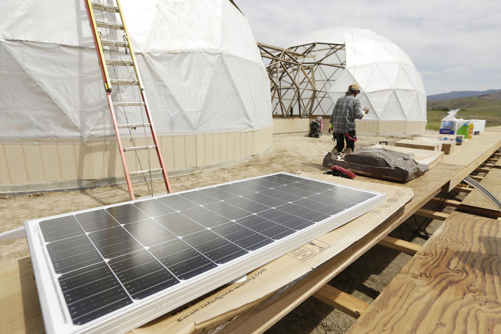 A solar panel that is intended to provide energy for fans in the geodesic dome is seen at a micro-farm