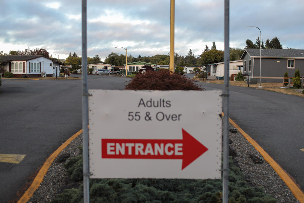 A sign at the entrance to Leisure Manor reads Adults 55 & over