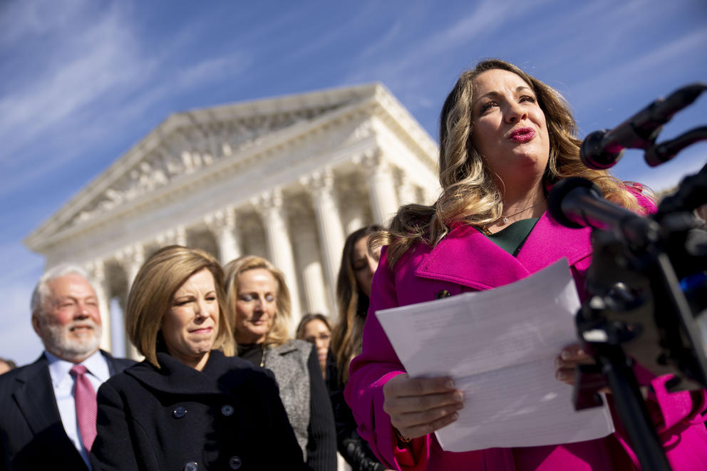 Lorie Smith speaks in front of the U.S. Supreme Court
