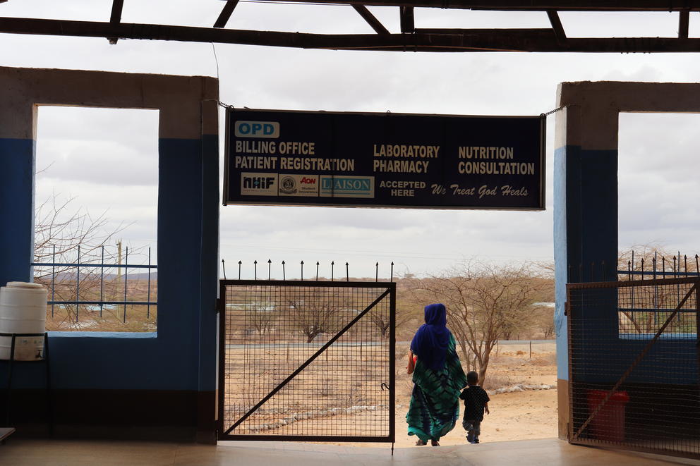 A mother and her son exit the grounds of the Catholic hospital in Laisamis, Kenya