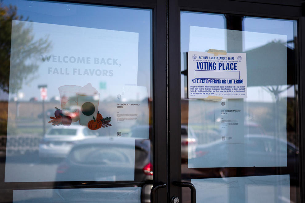 A election sign posted on a closed Starbucks window.