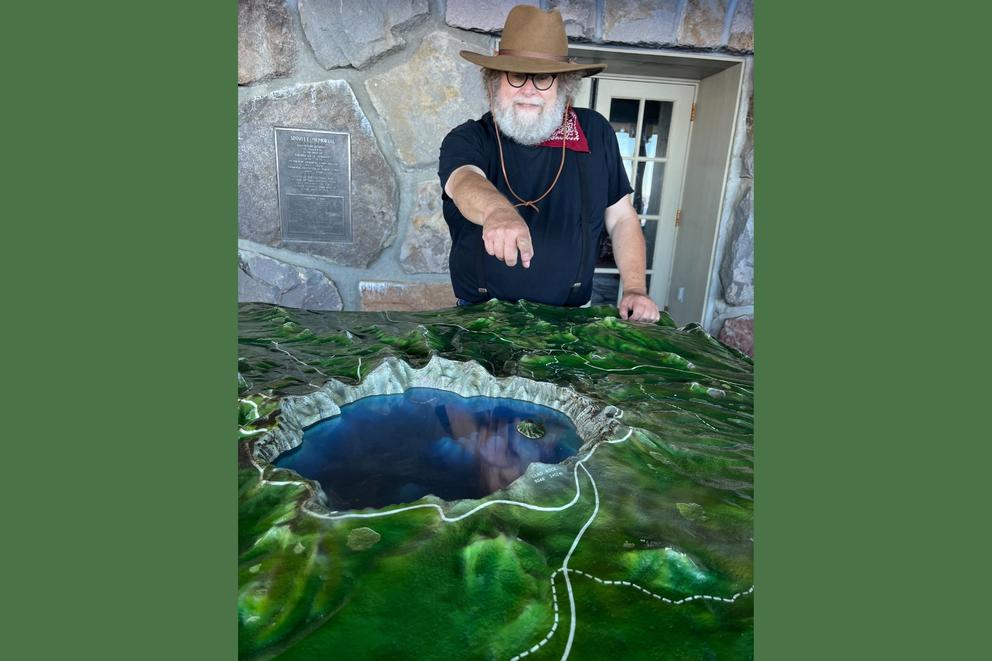 Knute Berger points to a location on a 3-D map of Crater Lake