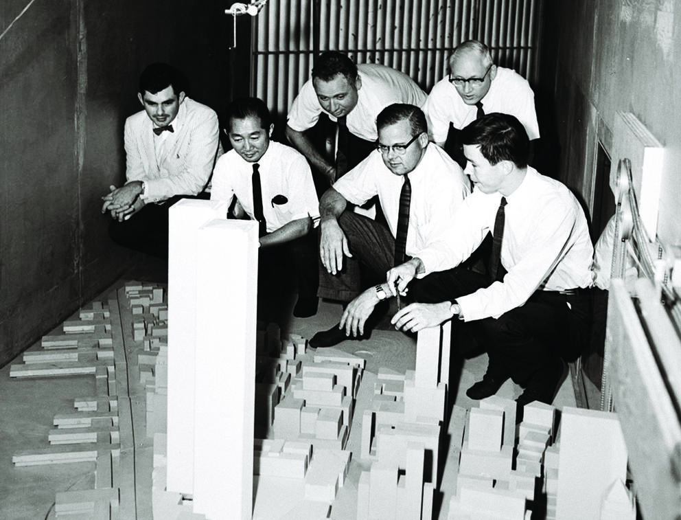 old photo of architects with models of the World Trade Center
