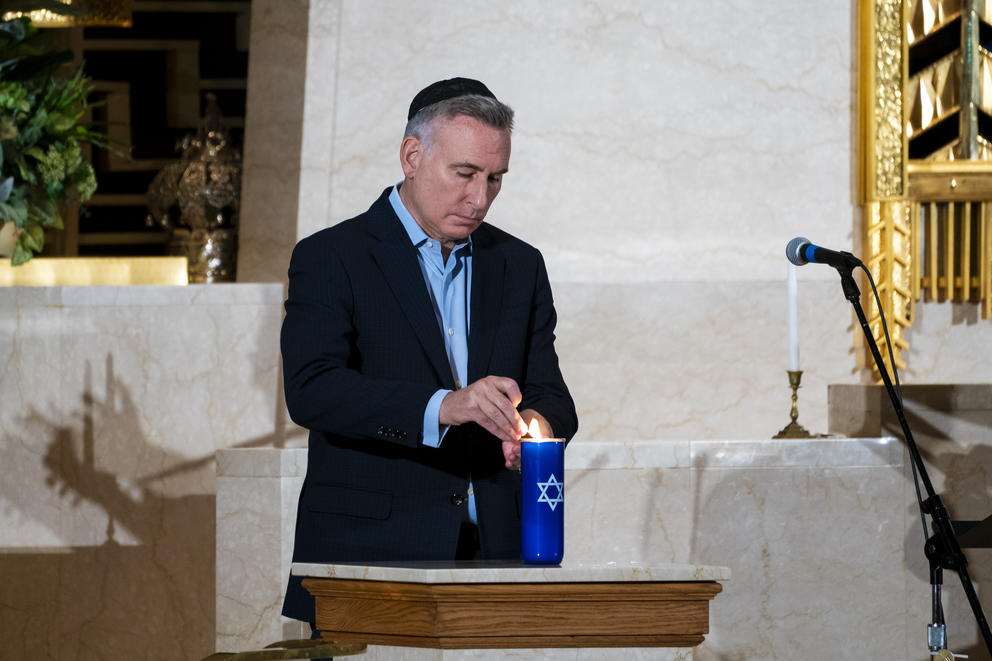 Dow Constantine lights a candle