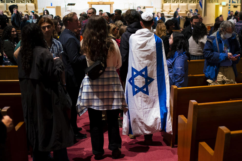 An attendee wears an Israeli flag during the event at Temple De Hirsch Sinai 