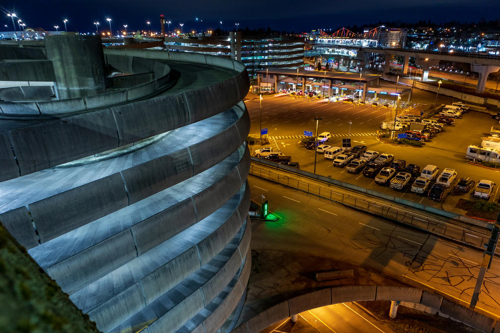 An overhead view of a parking garage at night