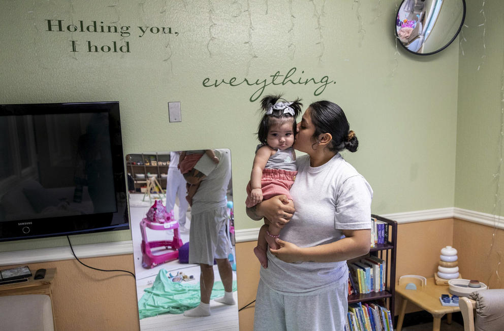 Christina Torres hugs her daughterJanessa in the playroom of J-Unit at Washington Corrections Center for Women