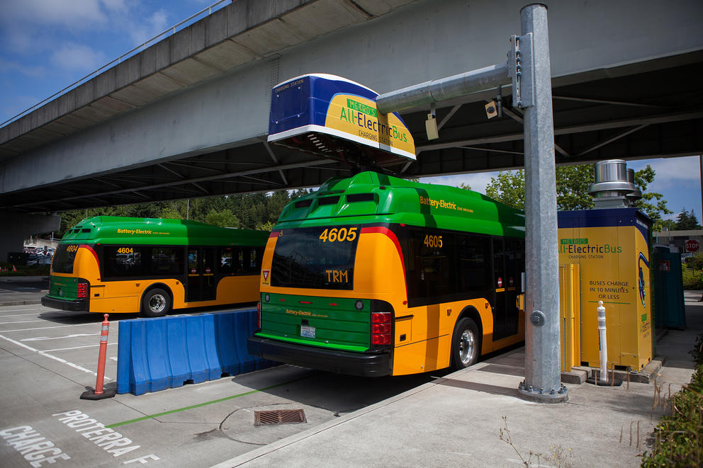A King County Metro battery bus charges at the charging station at Eastgate Transit Center 