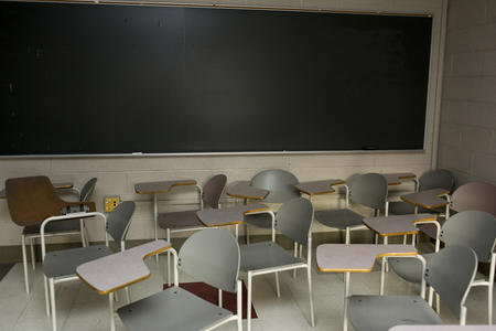Empty chairs and desks inside a classroom