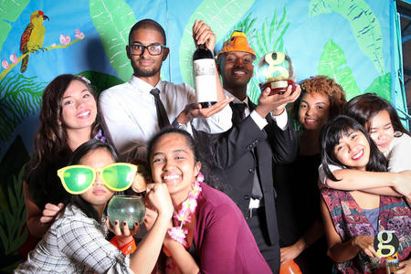 Journalists pose in a photo booth