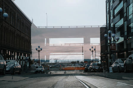 A double exposure of the waterfront with and without the viaduct